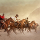 Artwork by Rich Allela and Kureng Dapel depicts African warriors on horseback.
